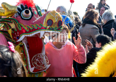 Eastbourne, UK. 17th Feb, 2019.  Thousands gather to celebrate the Chinese New Year 2019 the year of the Pig at this busy seaside resort. The Dragon dancers made their way through the newly opened Beacon shopping centre before reappearing into beautiful sunshine. The Dragons then paraded through the busy streets of Eastbourne and onto the Eastbourne Pier where they entertained locals and tourists with music and dance. Credit: Newspics UK South/Alamy Live News Stock Photo