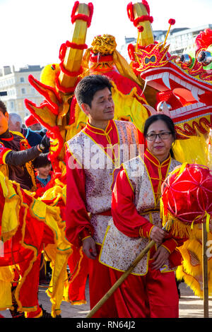 Eastbourne, UK. 17th Feb, 2019.  Thousands gather to celebrate the Chinese New Year 2019 the year of the Pig at this busy seaside resort. The Dragon dancers made their way through the newly opened Beacon shopping centre before reappearing into beautiful sunshine. The Dragons then paraded through the busy streets of Eastbourne and onto the Eastbourne Pier where they entertained locals and tourists with music and dance. Credit: Newspics UK South/Alamy Live News Stock Photo