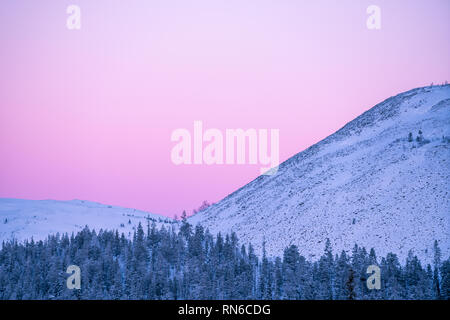 Detail of snow covered fells during sunset with copy space in Äkäslompolo, Finland