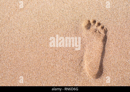 A single man's footprint captured on the beach of Sanur in Bali, Indonesia Stock Photo