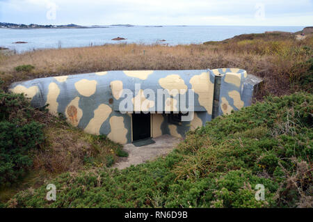 Camouflaged WW2 German Bunker for a 10.5cm Coast Defence Gun on the Coastal Path on the North Shore of Vazon Bay, Guernsey, Channel Islands.UK. Stock Photo