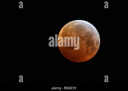 Eclipse of the super moon, lunar eclipse, red supermoon, blood moon / Blutmond, red orange full moon with sparkling stars on January 21, 2019, Germany Stock Photo