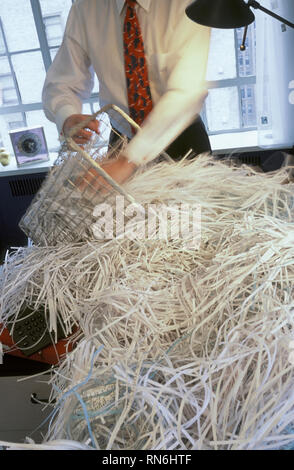 Businessman Shredding Documents, USA Stock Photo