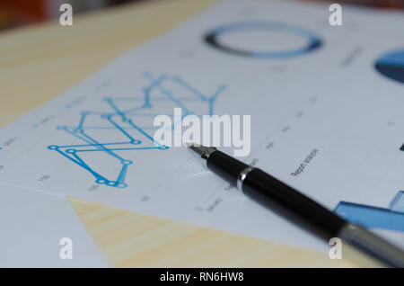 Business documents financial graphs, statistical analysis on desk. Stock Photo