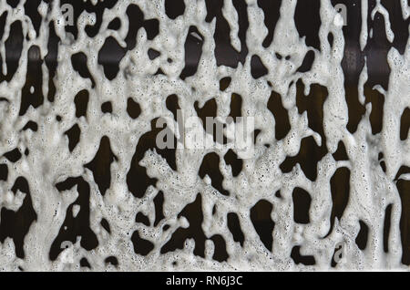 foam and soap on black background. Stock Photo