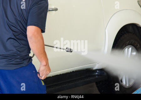 Cleaning Car Using High Pressure Water. Stock Photo