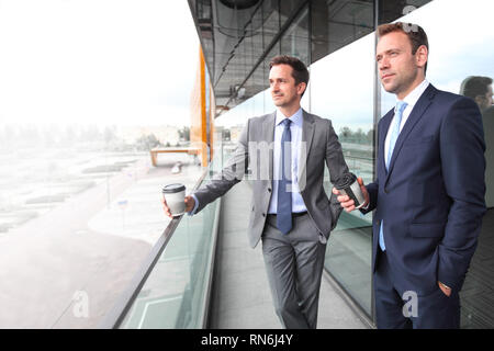 Business people having coffee break at the balcony of office building Stock Photo