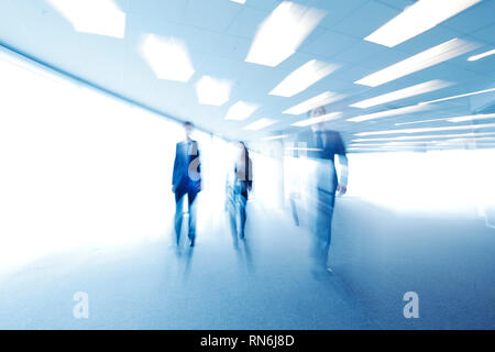 Blurred image of business people walking together in office Stock Photo