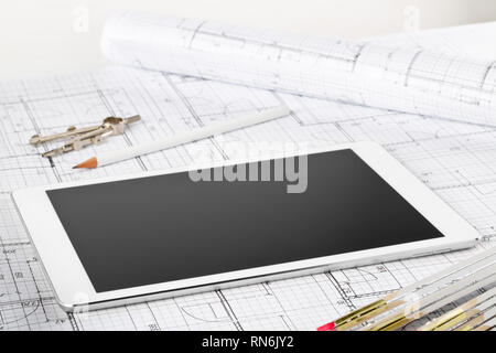 Tablet pc architectural blueprint house building plan with pencil, compasses and folding rule Stock Photo