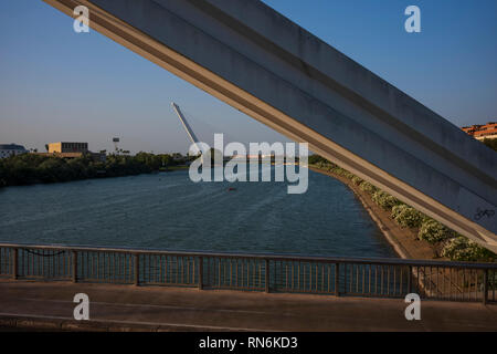 The Guadalquivir river, the fifth longest river of the Iberian Penisula, cuts through the city of Seville, Spain. Stock Photo