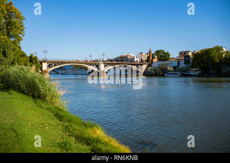 The Guadalquivir river, the fifth longest river of the Iberian Penisula, cuts through the city of Seville, Spain. Stock Photo