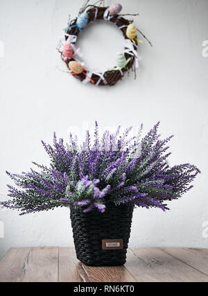 Happy Easter. Congratulatory easter background. Easter eggs and flowers. Stock Photo
