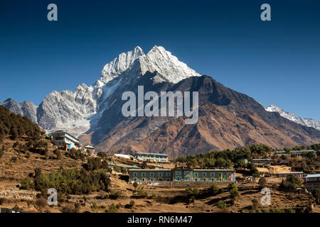 Nepal, Namche Bazaar, snow capped Thamserkhu peak above hilltop houses, Yeti Mountain Home and Hill Top Lodge and Restaurant Stock Photo