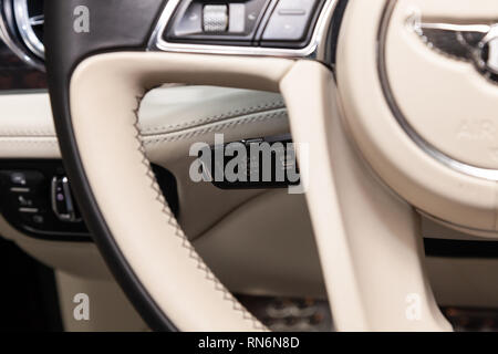 Novosibirsk, Russia - 08.01.18: Interior view with cruise-control of luxury very expensive new black Bentley Bentayga car stands in the washing box wa Stock Photo
