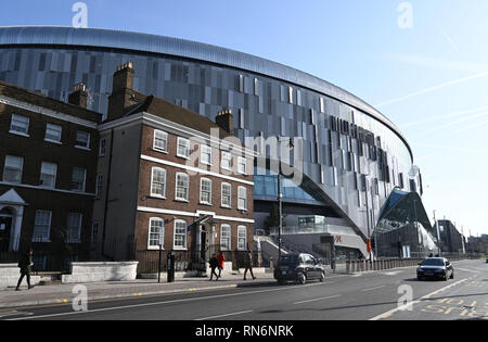 Tottenham London UK February 2019 -  The new Tottenham Hotspur Stadium towers above the surrounding buildings including Percy House in the High Rd Stock Photo