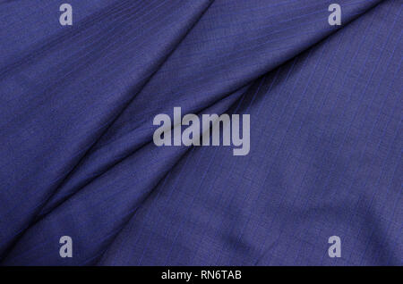 Wool fabric of dark blue color, costume fabric from wool 150 super Stock Photo