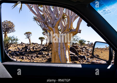 MESOSAURUS FOSSIL BUSH CAMP, NAMIBIA - 25 August 2018: side view mirror of a car , on road in the desert outback Stock Photo
