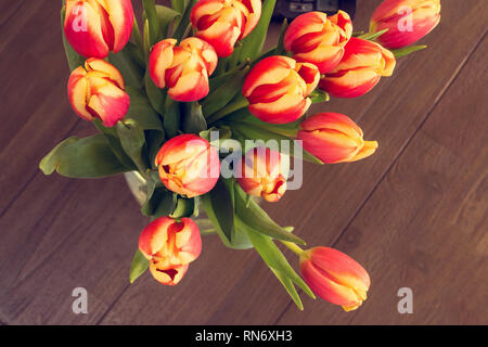 colorful tulips on wooden vintage background, april season Stock Photo