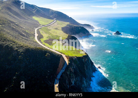 Aerial View Drone Shot of Highway Pacific Coast Highway California USA Big Sur Mountains Ocean Fog Stock Photo