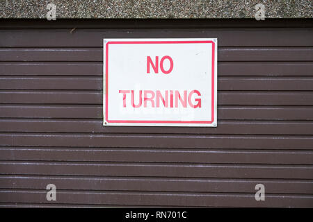 No turn of vehicles cars sign on private garage driveway Stock Photo