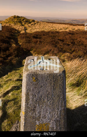 Ordnance Survey triangulation point or pillar on the summit of Cyrn y Brain North Wales next to the ruins of Sir Watkins tower Stock Photo