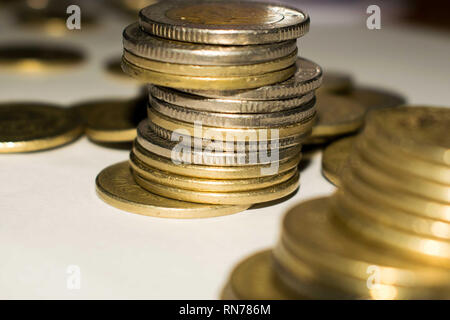 Piles of shiny gold coins Stock Photo
