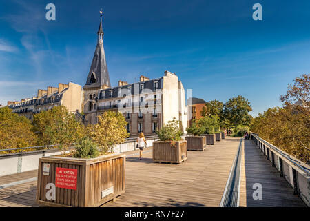People walking along the elevated urban garden of Promenade Plantée , an elevated park walkway in the 12th arrondissement of Paris, France Stock Photo