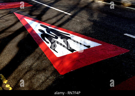 School zone childrens road safety marking sign for motorists Stock Photo