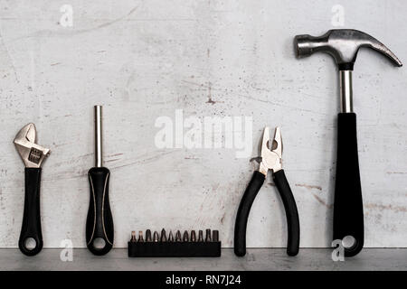 Construction tools are located on a light concrete background Stock Photo