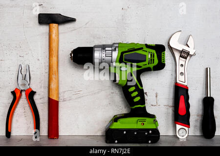 Construction tools are located on a light concrete background Stock Photo
