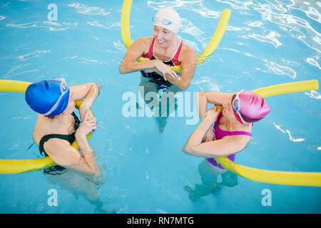 Three Women Relaxing in Pool