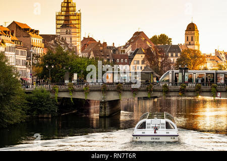 Strasbourg, Alsace, France, Batorama sightseeing river cruise boat, Ill river, Pont Royal bridge, tram stop, late afternoon light, Stock Photo