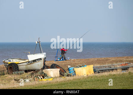 An angler competes in Europe's largest beach angling festival, the Paul Roggeman European Open Beach Championship, in the East Riding of Yorkshire. Stock Photo