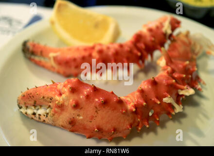 Closed Up Ushuaia King Crab Legs with a Piece of Lemon, Ushuaia, Argentina Stock Photo