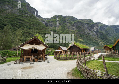 Dramatic outdoor view of reconstructed traditional viking village with fjord views in background. Stock Photo