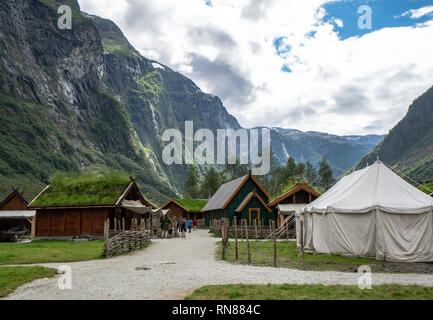 Dramatic outdoor view of reconstructed traditional viking village with fjord views in background. Stock Photo