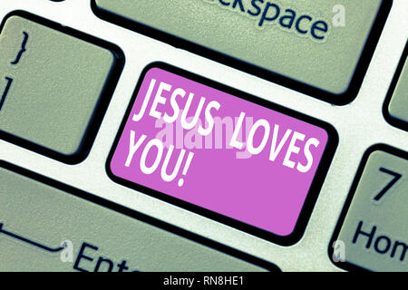 Text sign showing Jesus Loves You. Conceptual photo Believe in the Lord To have faith religious demonstrating Keyboard key Intention to create compute Stock Photo