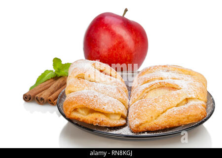 Apple and Cinnamon and mint sugar buns on dish.  Stock Photo