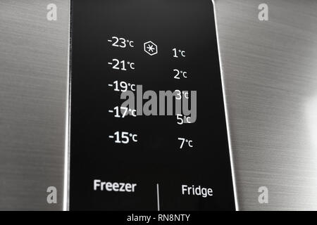 Modern steel colored fridge and freezer control panel. Internet of things abstract concept. Stock Photo