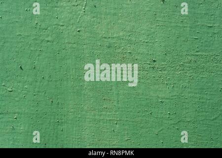 Texture background green painted cracked iron surface. Stock Photo