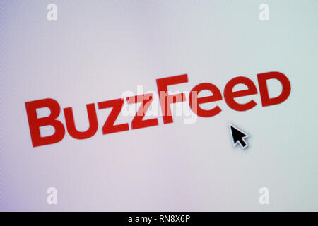 The logo of Buzzfeed is seen on a computer screen along with a mouse cursor (Editorial use only) Stock Photo