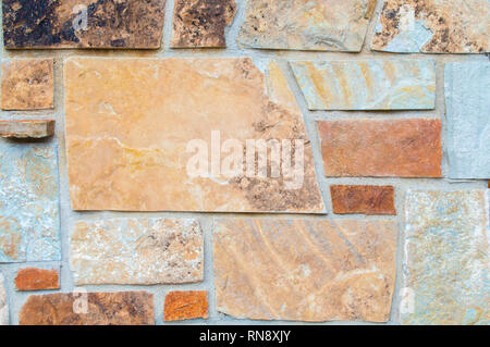 background texture-close up of a colorful granite stone wall Stock Photo