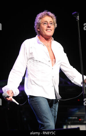 Singer Roger Daltrey, most commonly known as the vocalist of The Who, is shown performing on stage with his solo band during a 'live' concert appearance. Stock Photo