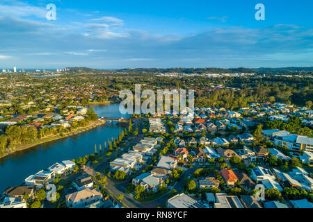 Aerial landscape of Varsity Lakes suburb and Reedy Creek at sunset. Gold Coast, Queensland, Australia Stock Photo