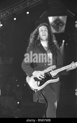 Def Leppard guitarist Vivian Campbell is shown performing on stage during a concert appearance. Stock Photo