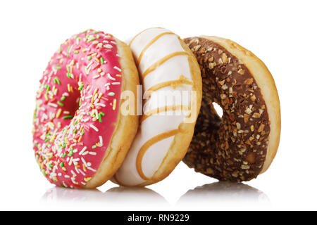 Three fresh donuts with various fillings isolated on white background Stock Photo