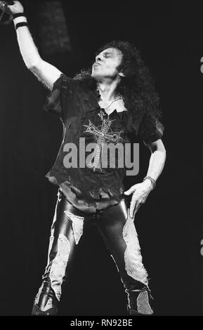 Singer Ronnie James Dio is shown performing on stage during a 'live' concert appearance. Stock Photo