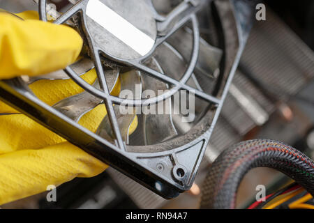 desktop computer dust cleaning. cpu cooller system with dust and web in the hand. Stock Photo