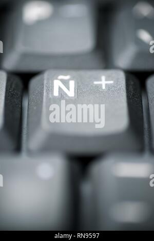 Spanish letter on a gray laptop keyboard. Stock Photo