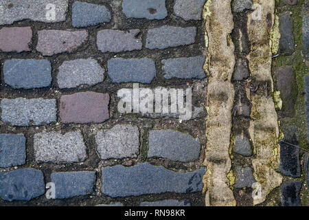 Double Yellow Lines Painted on Cobble Road Stock Photo
